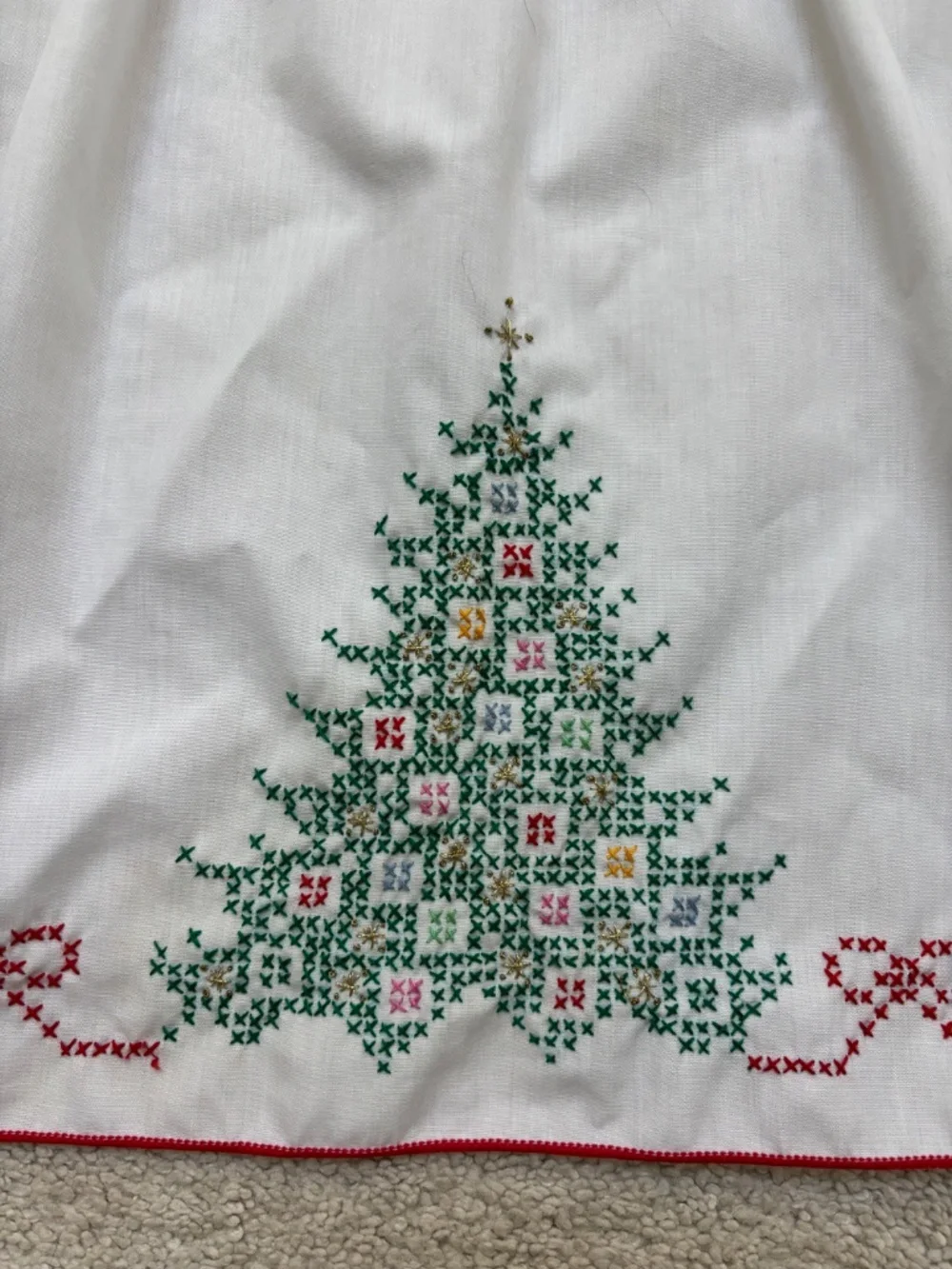 Vintage white half apron featuring hand-stitched cross-stitch Christmas trees